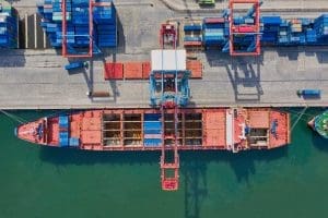 Red freight ship representing the jones act