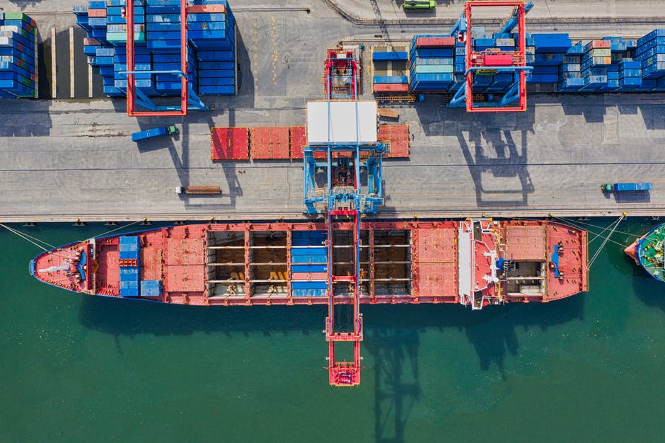 Red freight ship representing the jones act