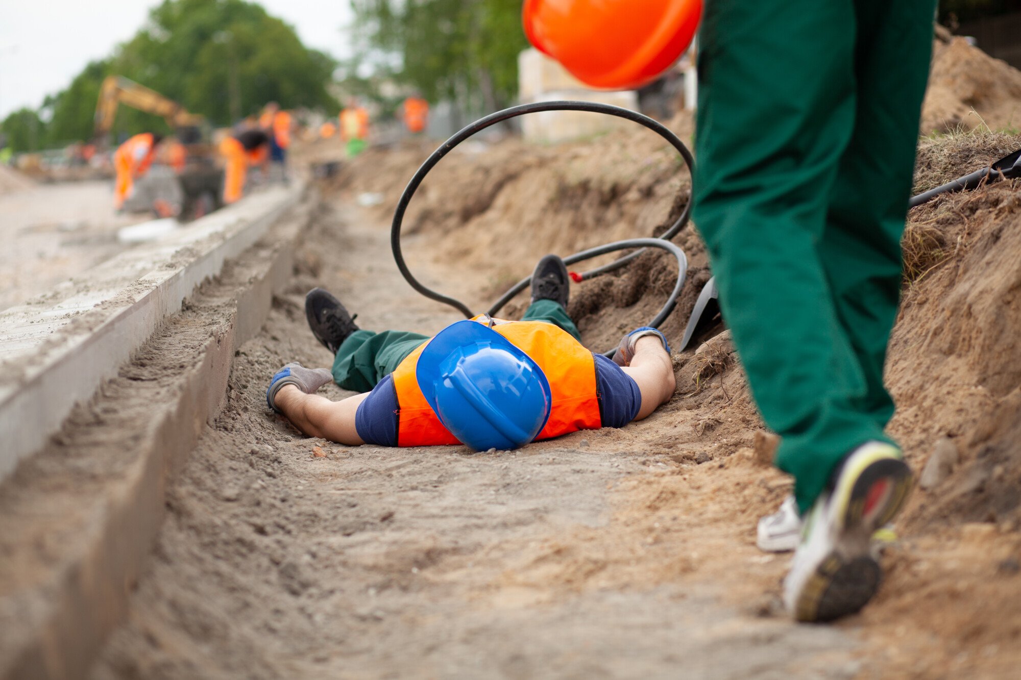 workplace injury construction workplace injury of worker lying on ground